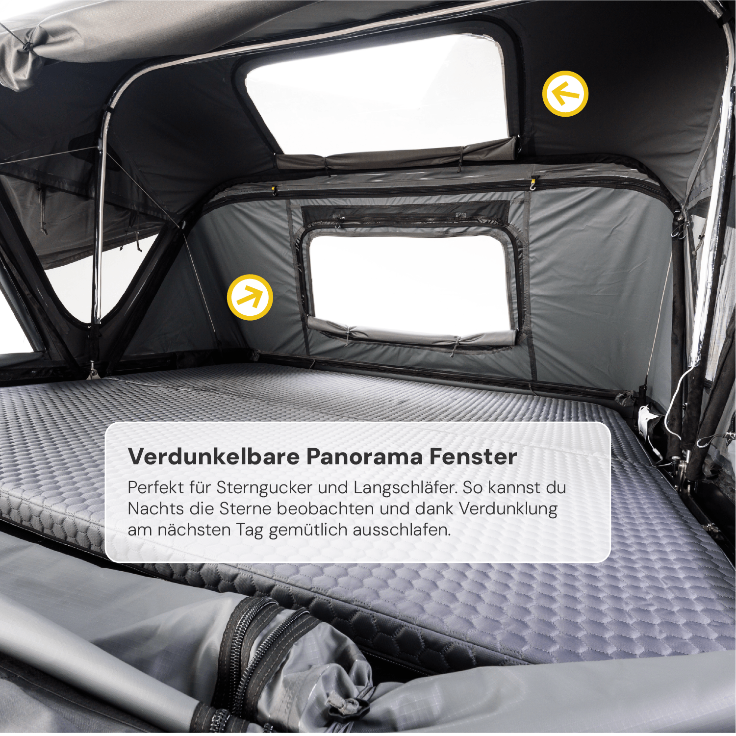 Innenansicht eines Dachzeltes mit grauer Matratze, Panoramafenstern und Verdunkelung, Text: "Verdunkelbare Panorama Fenster".