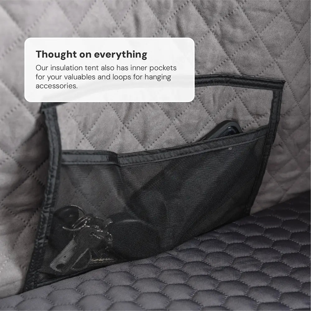 Close-up of a grey inner tent with a black mesh pocket filled with keys and a mobile phone. Text: "Thought of everything... accessories to hang up."