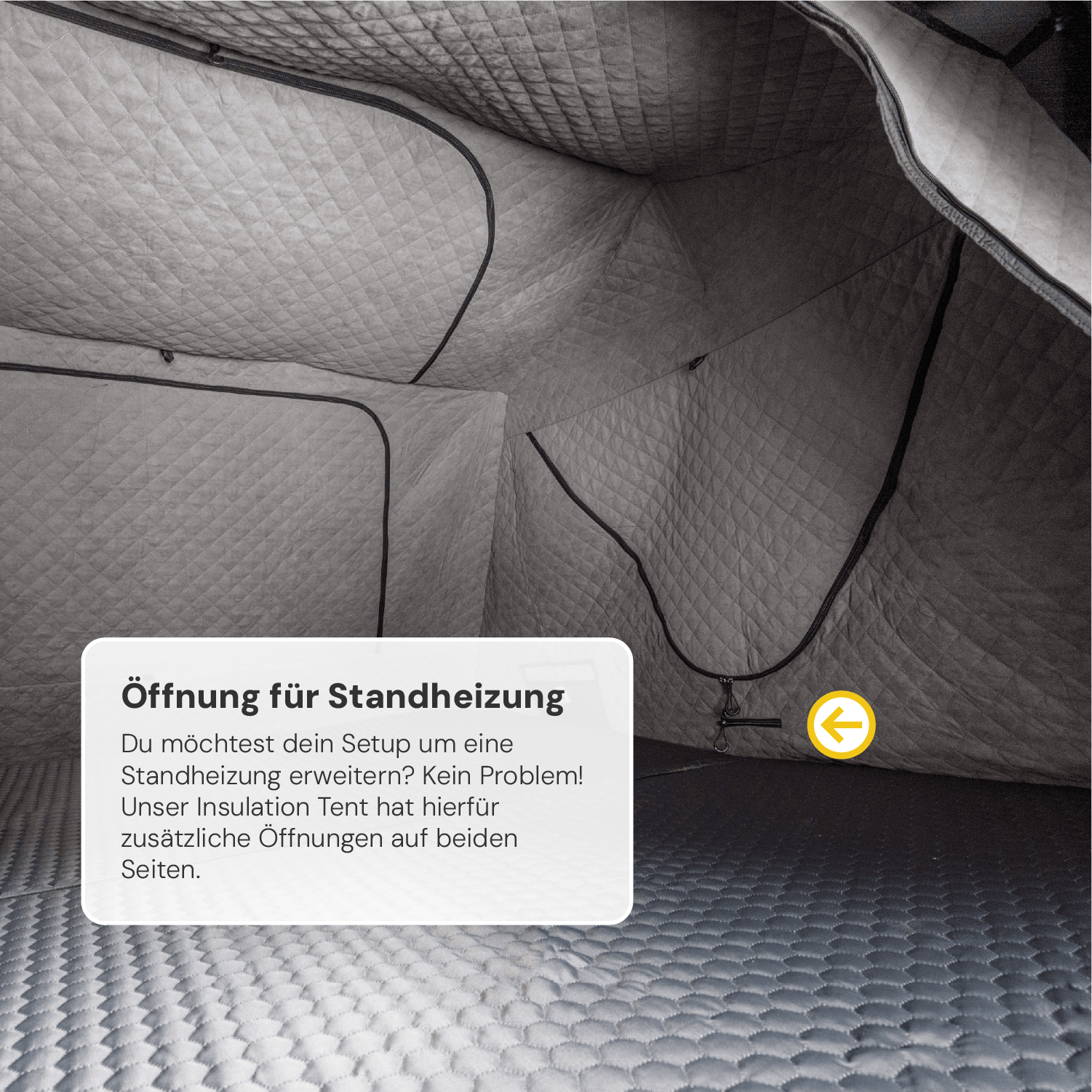 Innenansicht eines grauen, gesteppten Zeltes mit schwarzen Einfassungen, Text "Öffnung für Standheizung" und gelbem Pfeil darauf.