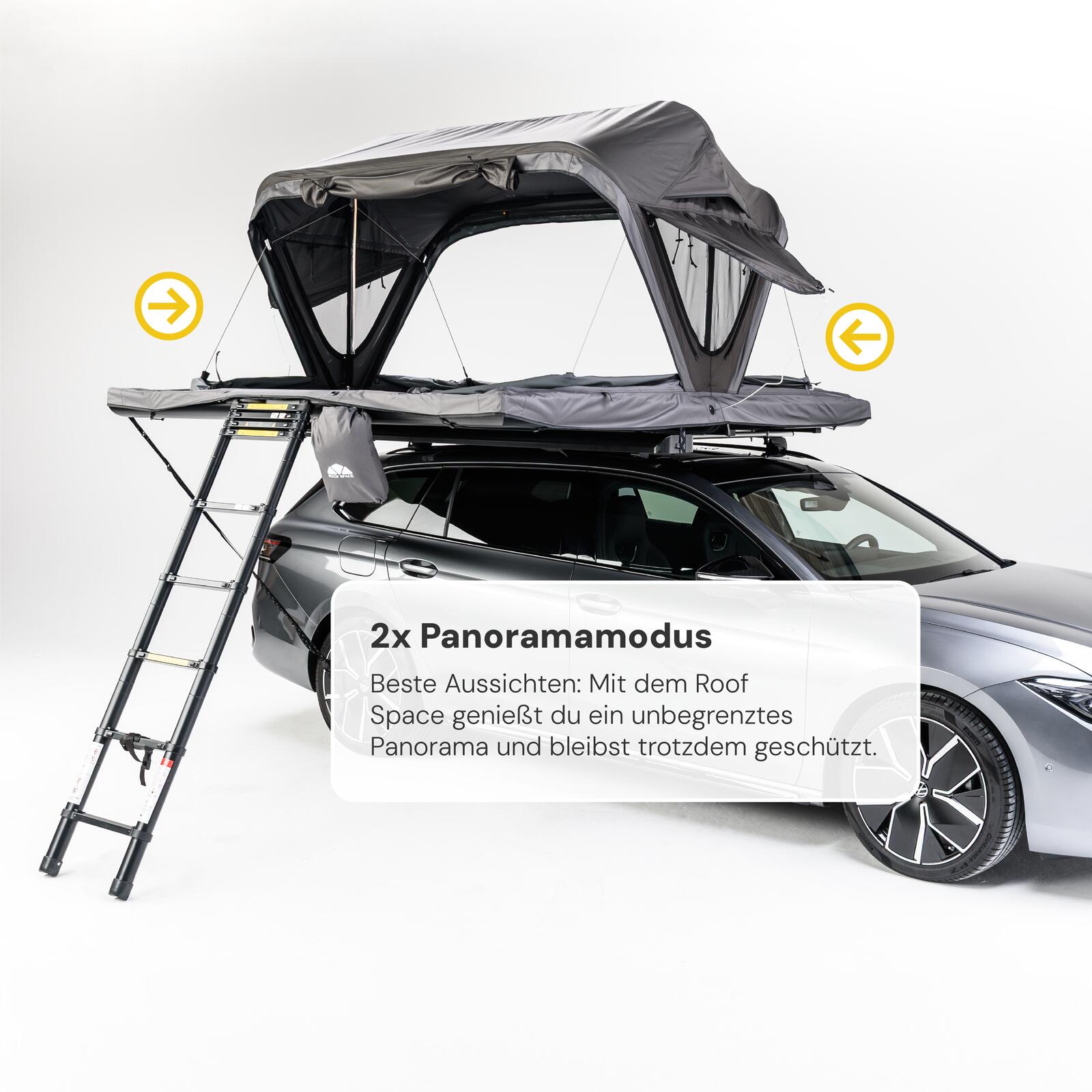 Grauer Kombi mit grauem Dachzelt und ausziehbarer Leiter vor weißem Hintergrund. Gelbe Pfeile zeigen seitliche Öffnungen. Text: "2x Panoramamodus. Beste Aussichten...".