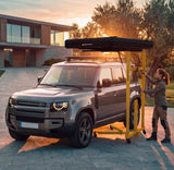 Universal roof tent lift from Roof Space, shown in use during the mounting of a roof tent on a Defender.