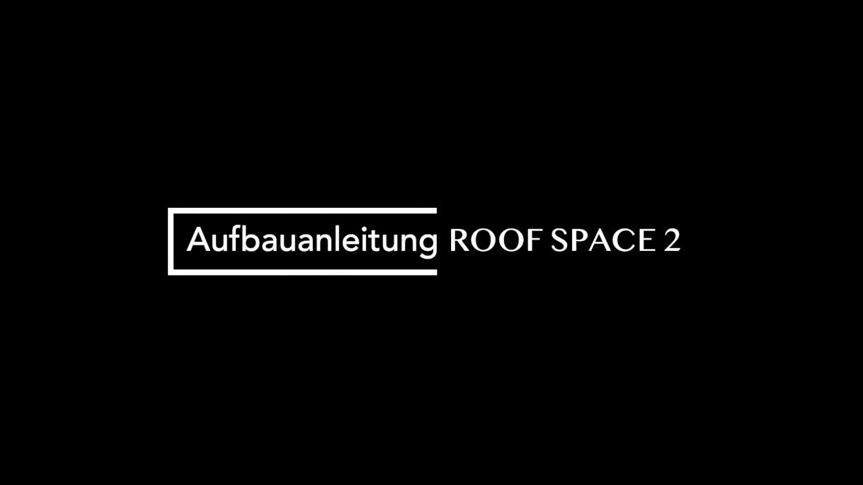 Weißer Text "Aufbauanleitung ROOF SPACE 2" auf schwarzem Hintergrund, der Text ist linksbündig.